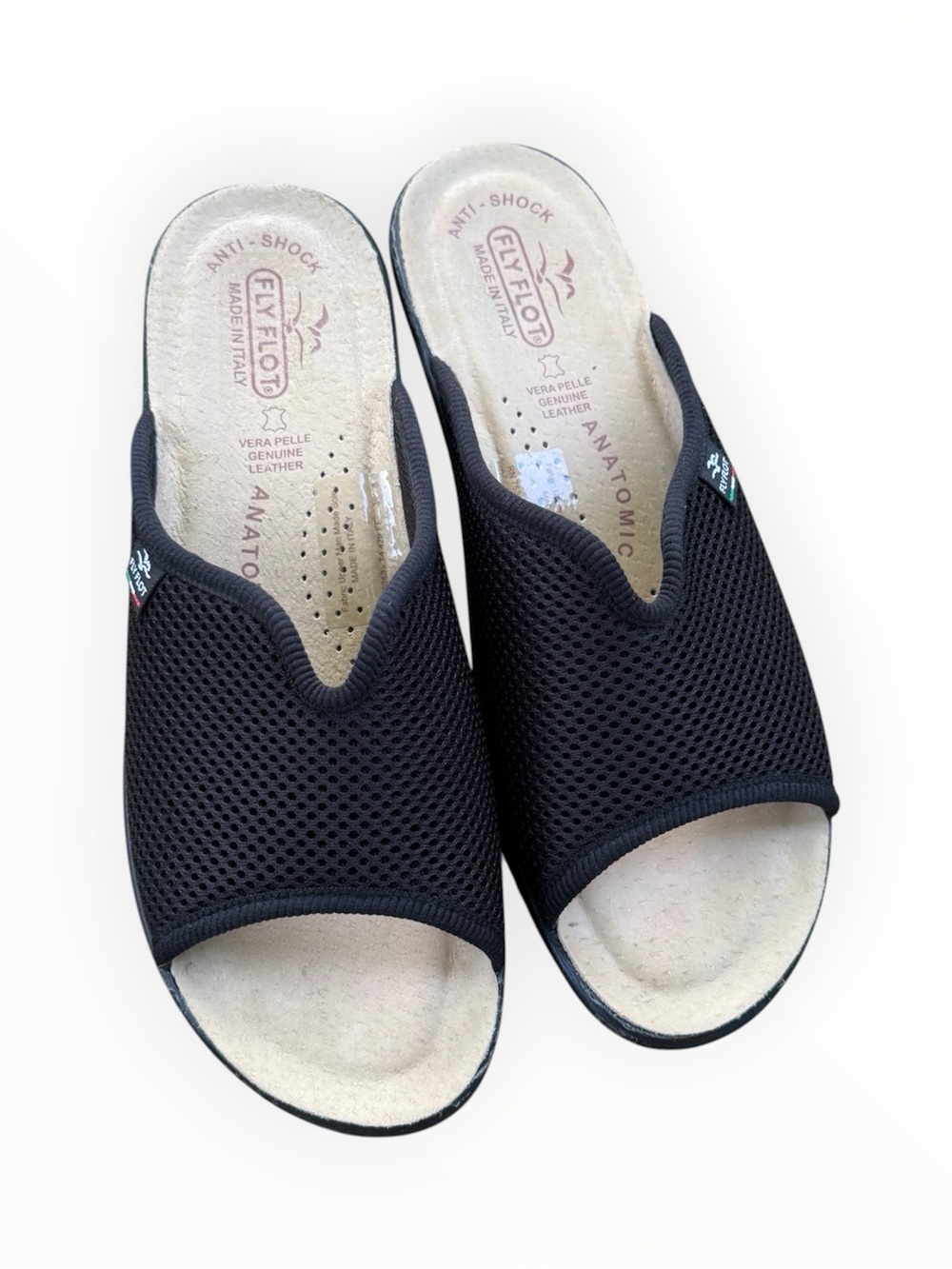Fly Flot anatomical sandals featuring a black mesh upper and leather insole